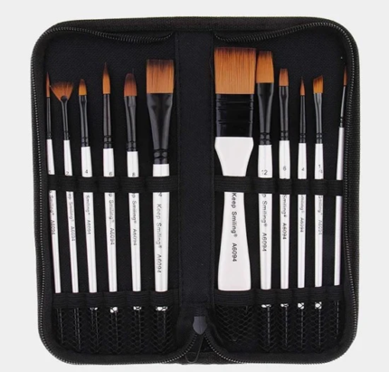 A 12-piece nylon brush set with various shapes and sizes, including liner, round, flat, fan, and comb brushes, stored in a compact travel wallet. The brushes are made from nylon, steel, and wood, ideal for use with acrylics, watercolors, gouache, and oils.